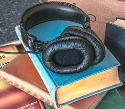 Earphones on stack of books