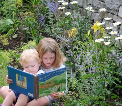 Children reading in garden