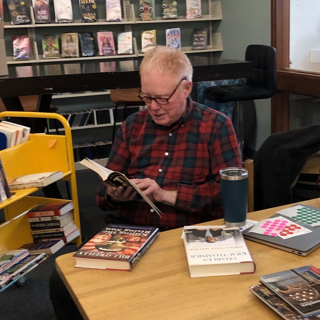 Mac McClelland sorting books