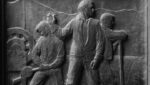 Bas relief of workers