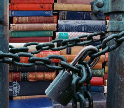 pile of books behind chain & padlock