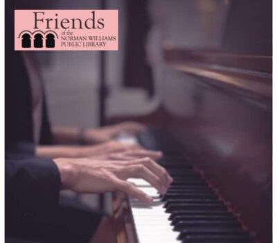 two sets of hands playing piano keyboard