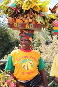 fruit seller with tray of fruit on head