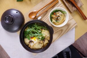 black bowl of Korean fish cake soup
