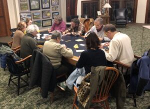 People around a big table playing games