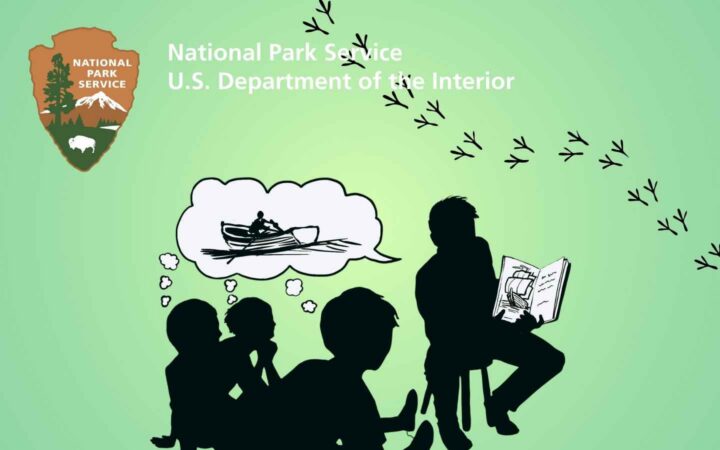 Children being read a story with animal tracks across a corner