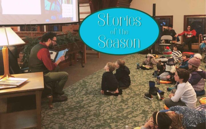 Reading stories to children with illustrations on the big screen